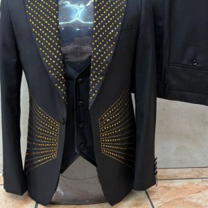 Grey 3 piece suit, carefully crafted to taste, and adorned with golden studs
